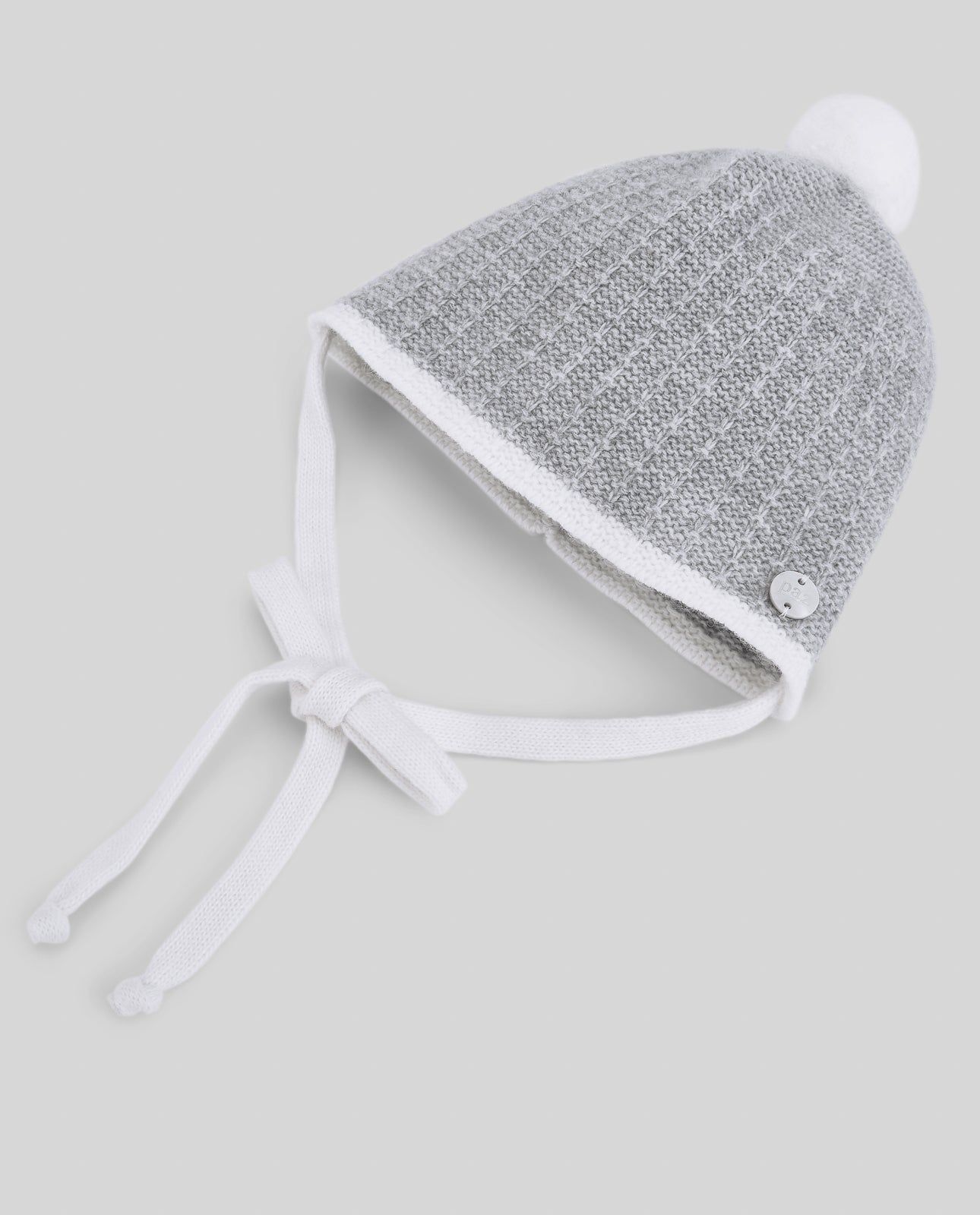 Gorro bebé menino com pompom em malha cinza da Paz Rodriguez "Neve"