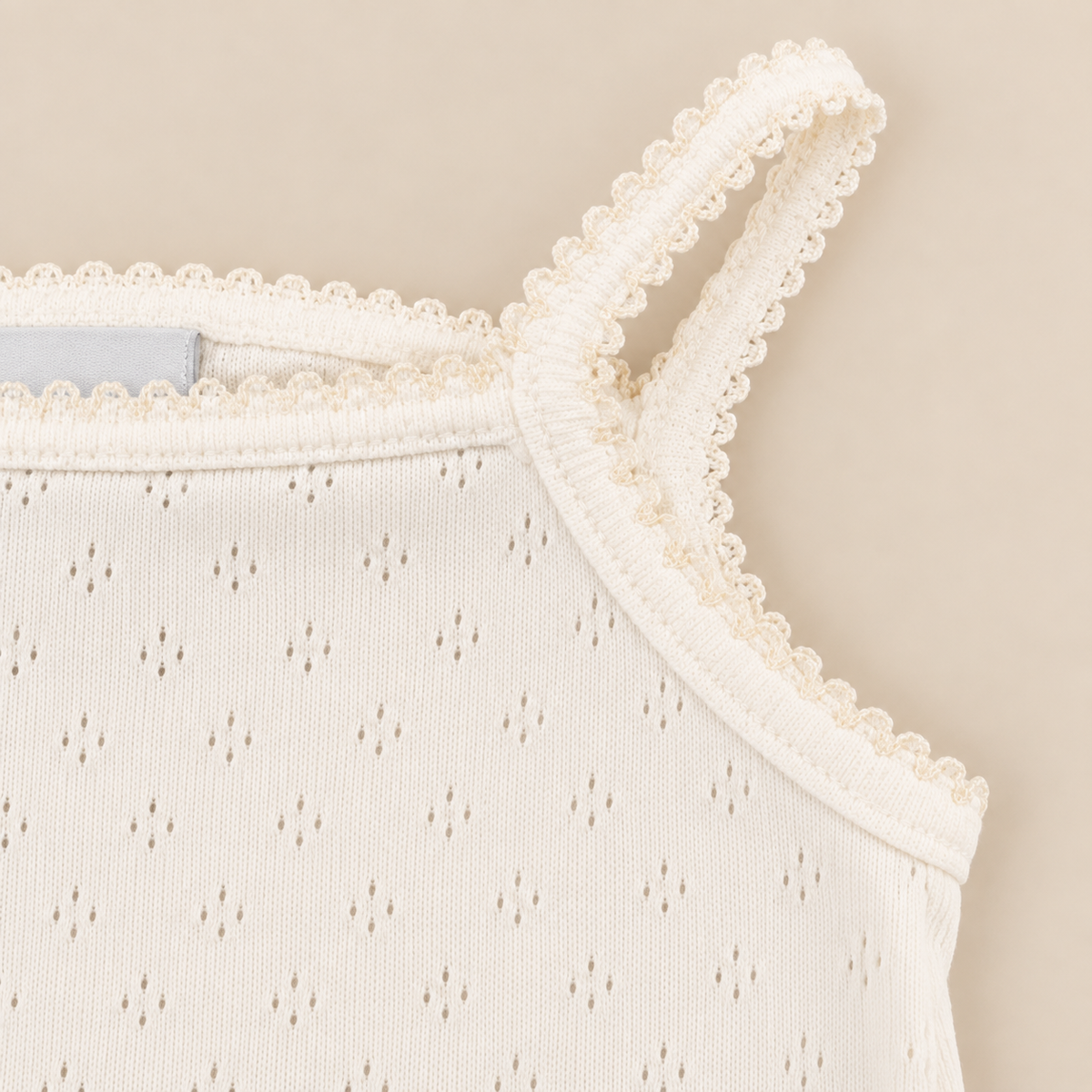 Body perola picotado de alças da The Baby Concept
