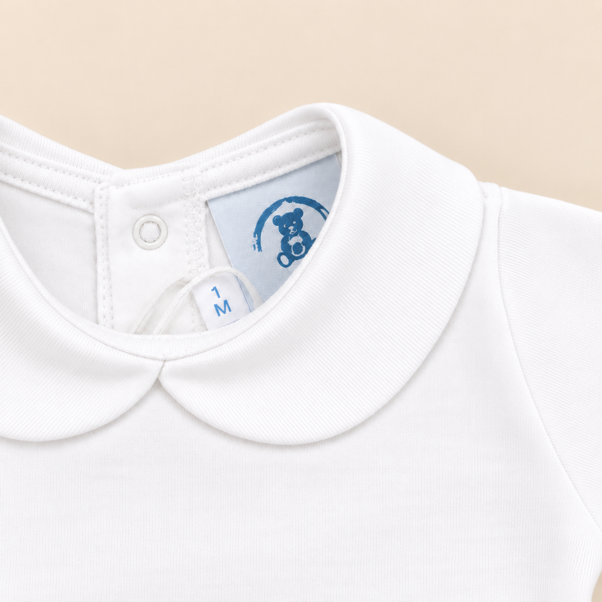 Body branco com gola pique da The Baby Concept