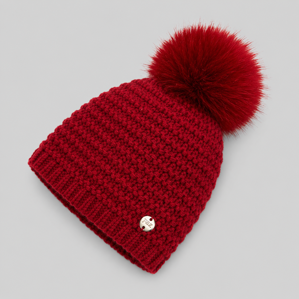 Gorro em malha vermelho com pompom da Paz Rodriguez "Nadal"