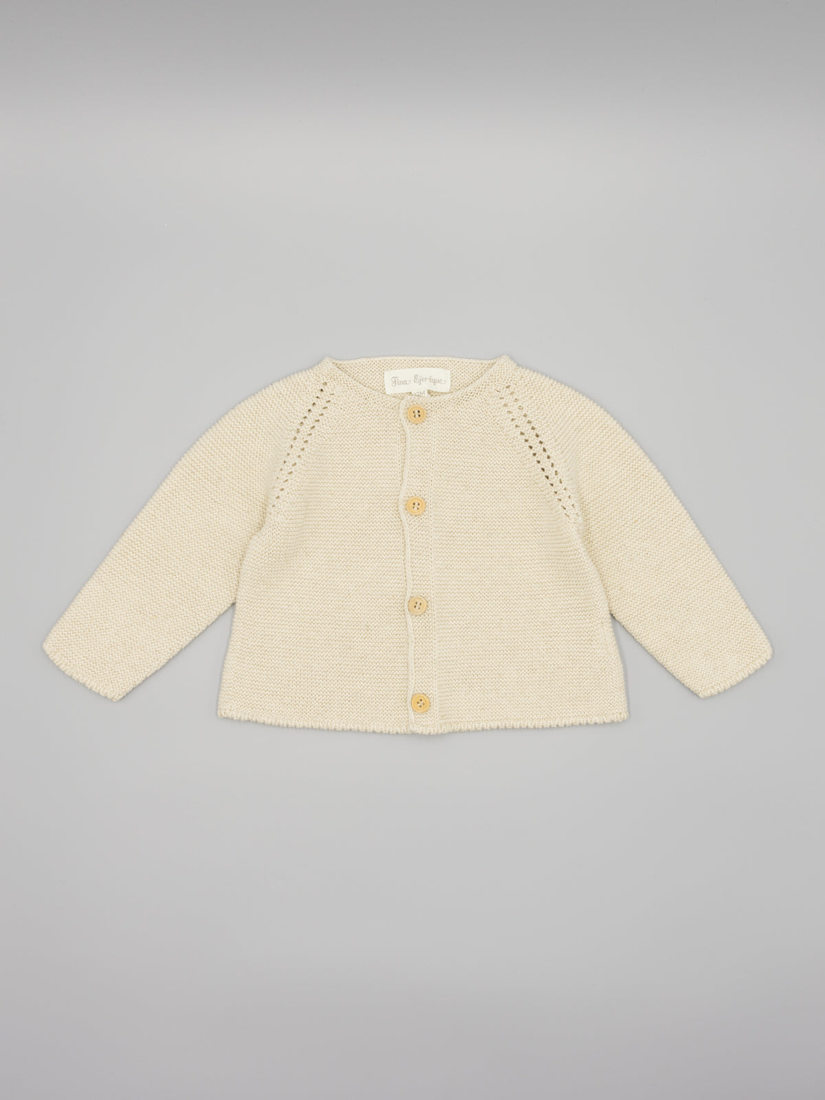 Casaco em malha bege da Fina Ejerique