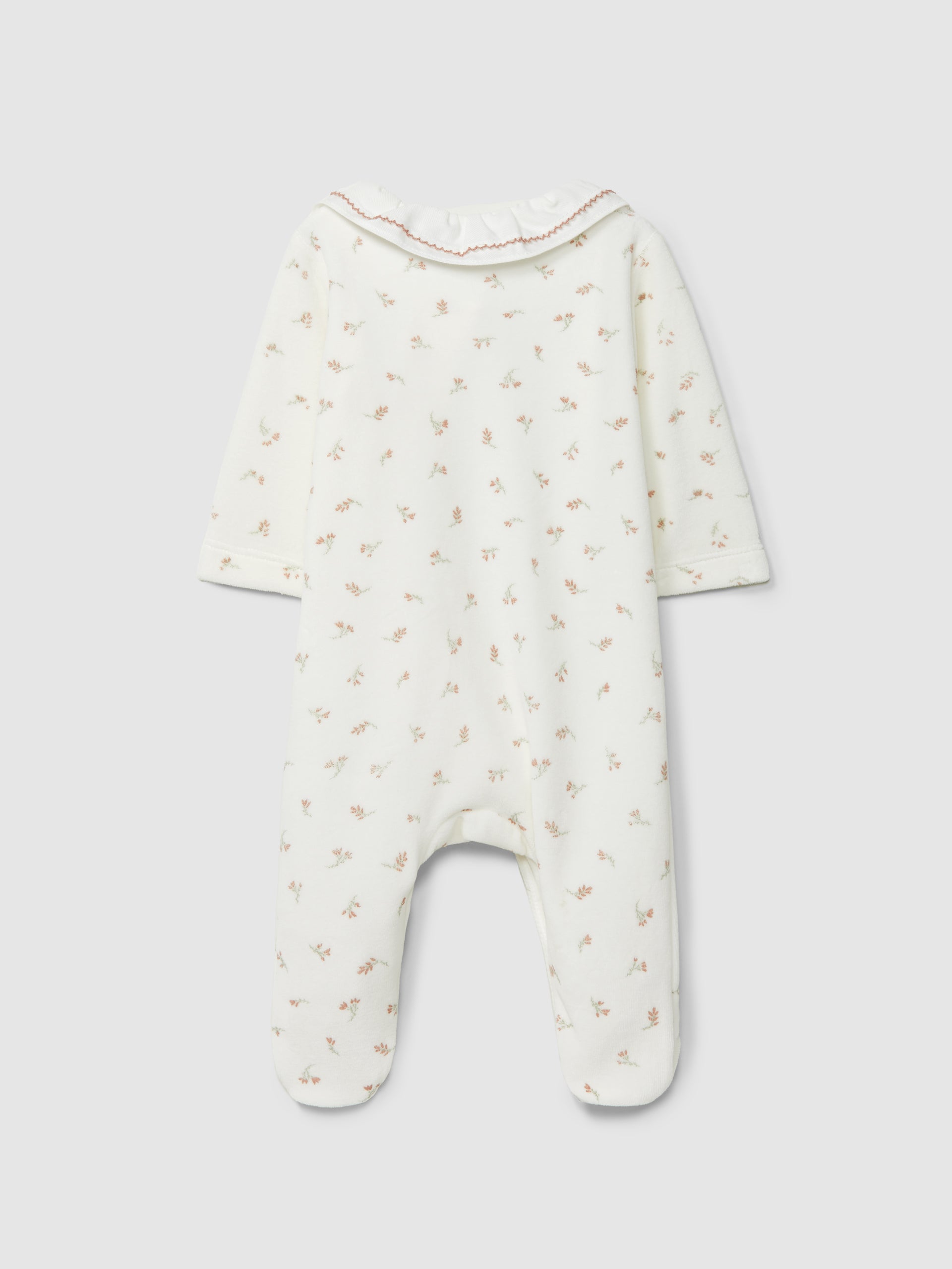 Babygrow de veludo com estampa floral e gola com babados da Laranjinha