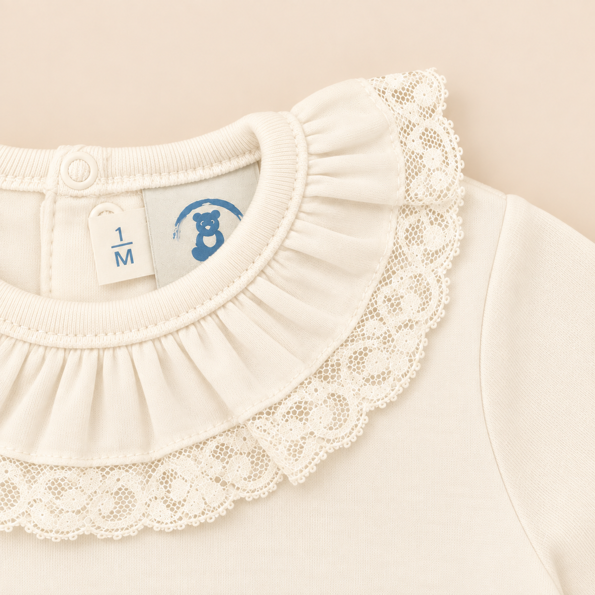 Body perola com renda valenciana da The Baby Concept